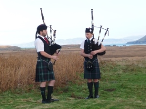 Two lone pipers on Remembrance Sunday on Mull